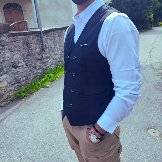 Side angle of sleeveless black polyester vest showing clean stitching and belt detail.