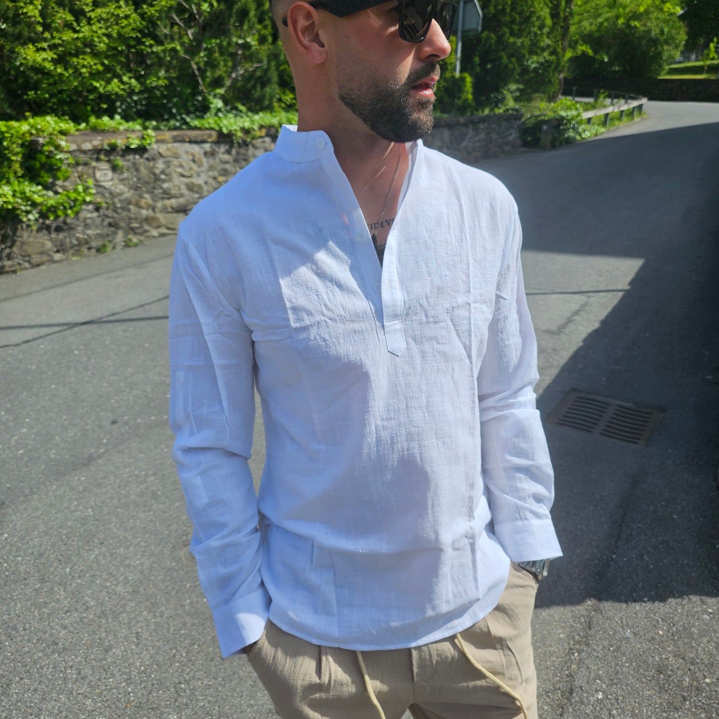 collar and button placket on a whitemen's linen Henley shirt