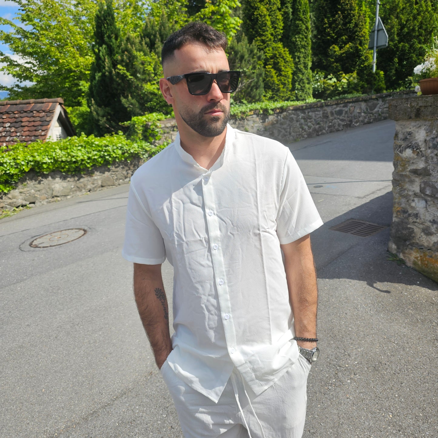 White variant of the men's 100% linen stand collar Henley shirt styled for casual spring/fall wear, showcasing the regular fit