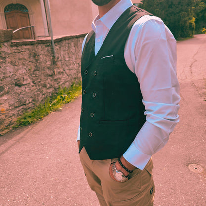 Close-up of button detail on woven fabric of men's casual formal vest.