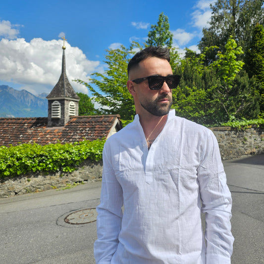 Close-up of the stand collar and button placket on a white men's linen Henley shirt