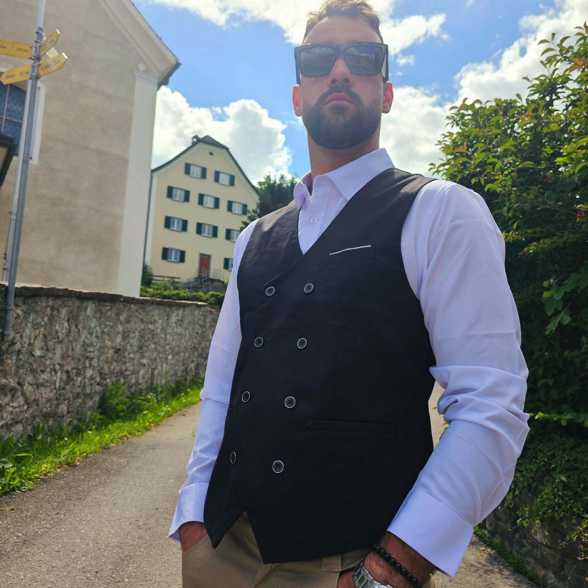 Front view of men's classic black V-neck buttoned vest with tailored fit.